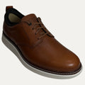 Brown leather shoe on a white background