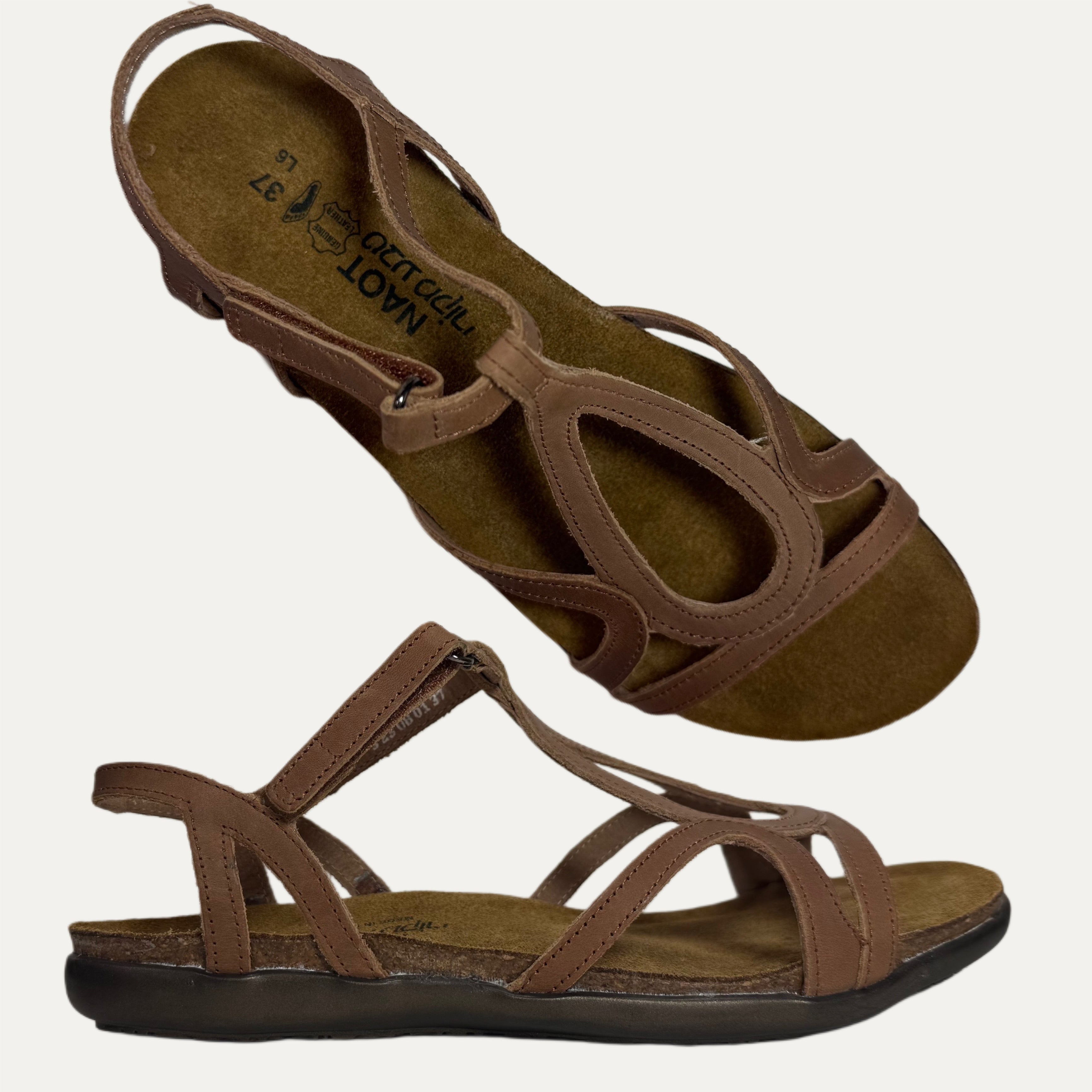 Brown sandals with multiple straps on a white background