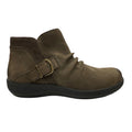 Brown ankle boot with a buckle on a white background