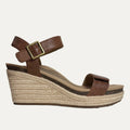 Brown wedge sandal with espadrille sole on a white background