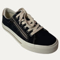 Black sneaker with beige laces on a white background
