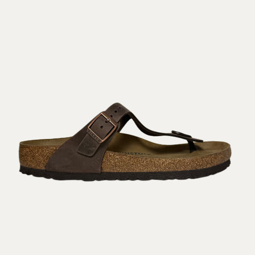 Brown sandal with cork sole on a white background