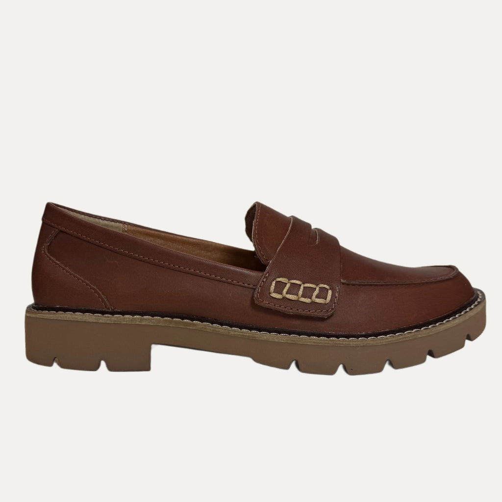 Brown loafer shoe on a white background