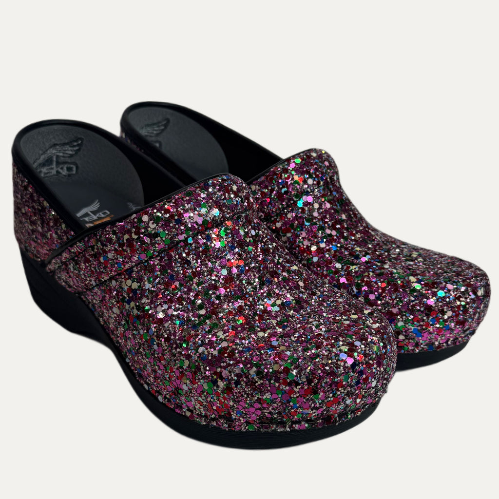 Pair of multicolor glittery clogs on a white background