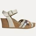 Wedge sandal with cork wedge and metallic straps on a white background