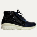 Black high-top sneaker with white sole on a white background