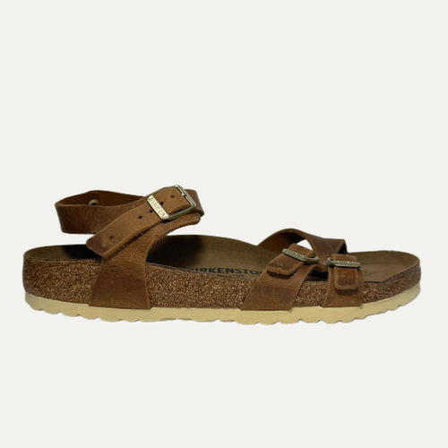 Brown sandal with cork sole on a white background