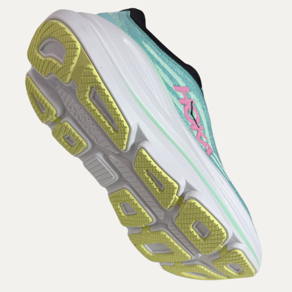 Close-up of a mint green hoka bondi 9 running shoe with a focus on the white and yellow sole and brand logo