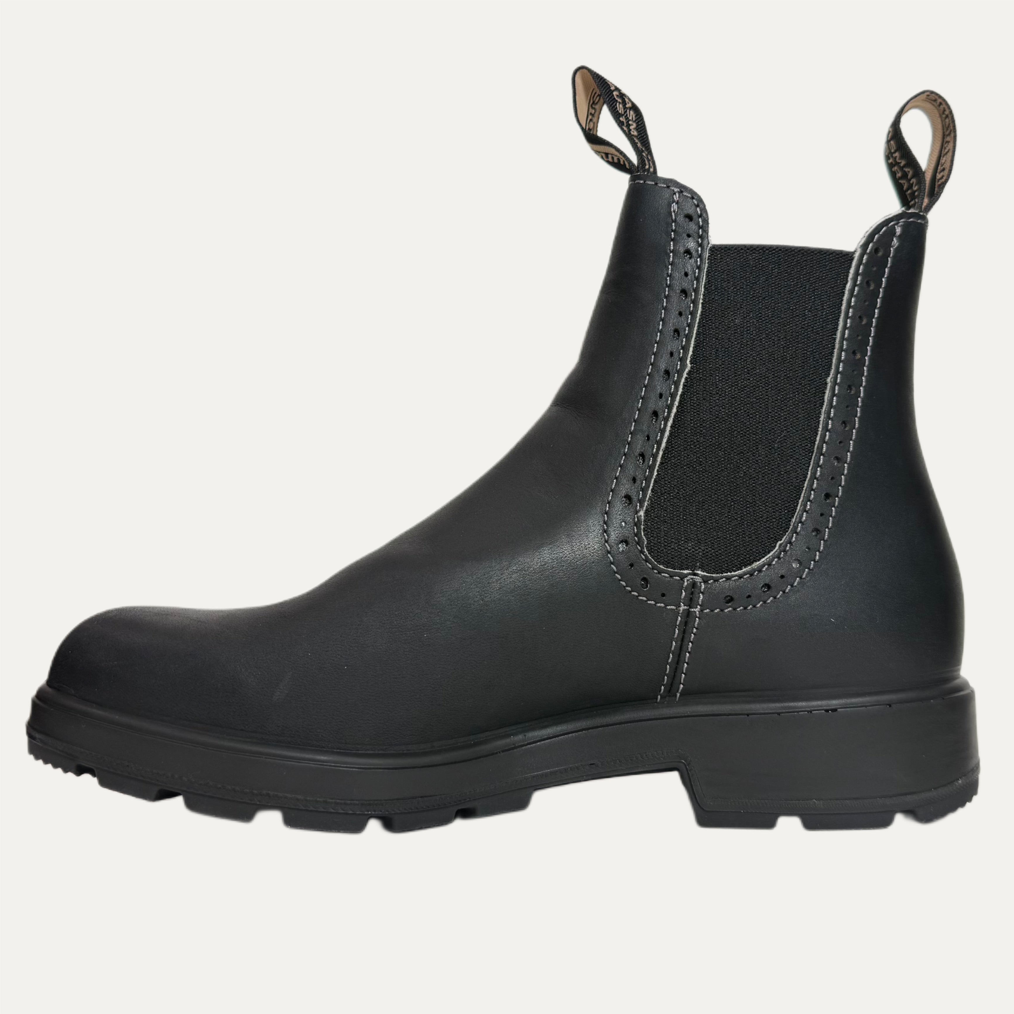 Black leather boot with a white background