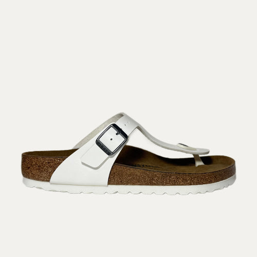 White sandal with a cork sole on a white background