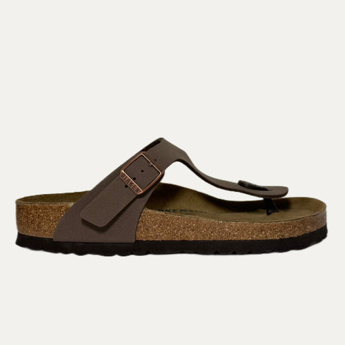 Brown sandal with a strap on a white background