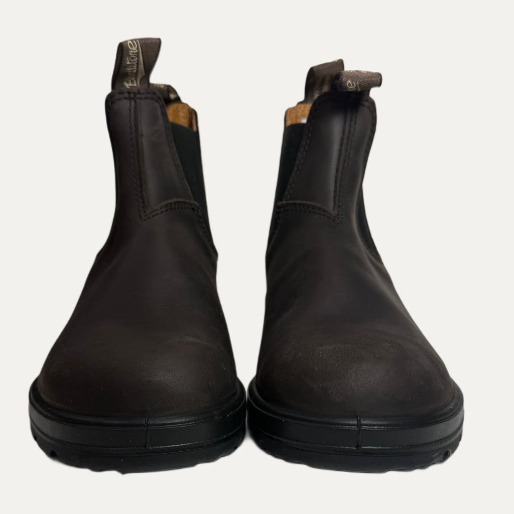 Pair of brown leather Chelsea boots on a white background
