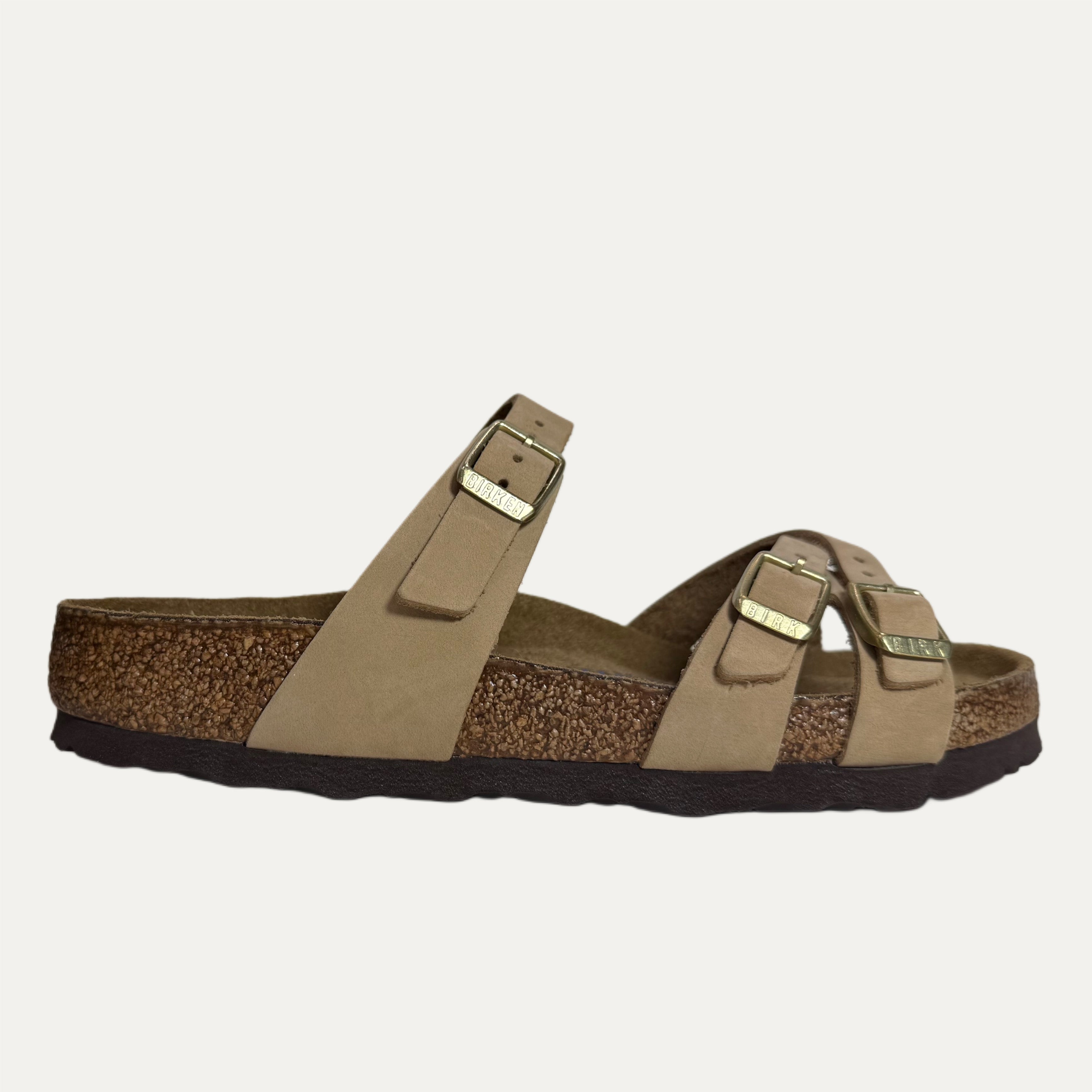 Brown sandal with cork sole on a white background