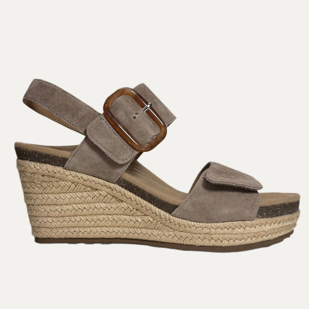 Brown wedge sandal with espadrille sole on a white background
