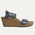 Silver wedge sandal with cork sole on a white background